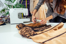 Caucasian Tailor Woman Sewing Lingerie In Showroom ,she Sewing Outfit For Wedding Night