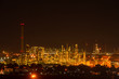 The colorful lights in oil refinery industry power station at night time with Twilight sky ,Chonburi,Thailand.