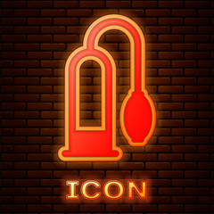 Glowing neon Penis pump icon isolated on brick wall background. Penis enlarger. Sex toy for men. Vacuum pump with a blower to increase the penis.  Vector Illustration