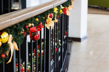 Christmas Decorations With Ribbons And Balls On Railing