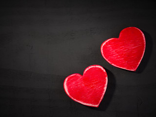 Two hearts on black wooden background.Backgrounds for special days ( Valentine's Day, Wedding Anniversary ) 