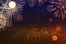 Golden Fireworks In The Dark Sky With Festive Bokeh. New Year Celebration Concept.