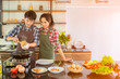 © Apiwan - Asian couples are preparing a healthy breakfast with happiness in the kitchen