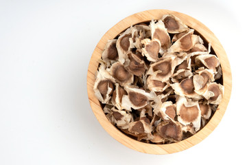 Wall Mural - Moringa Oleifera seed dried on isolated white background.