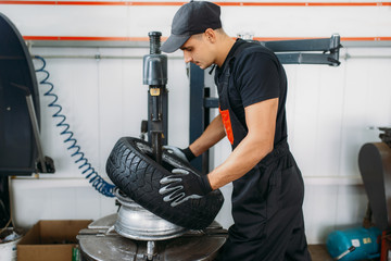 Wall Mural - Mechanic change tire, repairing service