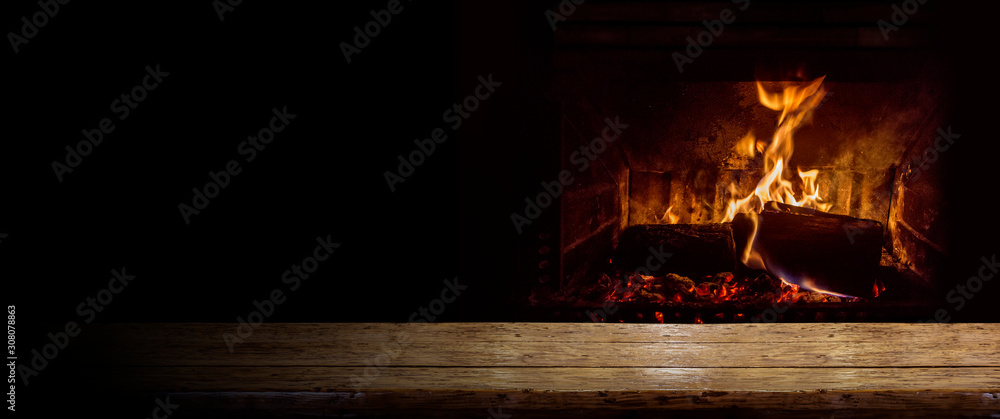 Empty table with burning fire - obrazy, fototapety, plakaty 