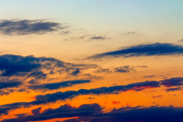 Wall Mural - orange sunset sky with clouds. beautiful nature background