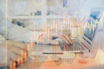 Fototapete - Multi exposure of stock market graph with man working on laptop on background. Concept of financial analysis.