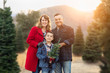 © Andy Dean - Mixed Race Family Outdoors At Christmas Tree Farm