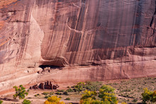 High Angle Landscape Of Red Stone Cliff And Trees At Canyon De Chelly National Monument In Arizona
