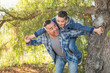 © Andy Dean - Mixed Race Father And Son Having Fun Piggy Back Outdoors