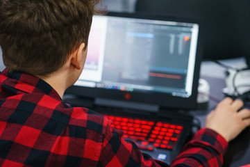 Developer of program code. Process of writing code in a special application.