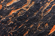 Black With Orange Spots Seamless Venetian Stucco. Background And Texture Of Decorative Plaster.