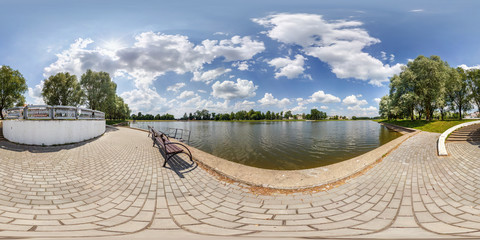 Wall Mural - full seamless spherical hdri panorama 360 degrees angle view on concrete pier of huge lake or river in sunny summer day among the bushes of small town in equirectangular projection, VR content