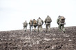 © Getmilitaryphotos - Army soldiers group on march in muddy field
