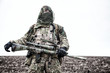 © Getmilitaryphotos - Army sniper standing in field with rifle