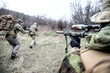 © Getmilitaryphotos - Commando army soldiers fighters squad rushing in woodland