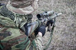 © Getmilitaryphotos - Kneeling commando army soldier marksman over shoulder view