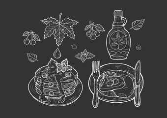 Wall Mural - pancakes with maple syrup on black background.