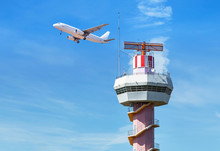 Radar  Air Traffic Control Tower In International Airport While Airplane Taking Off Under Blue Sky.        