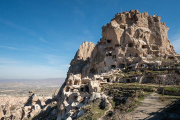 Wall Mural - Landscape of Cappadocia around the town of Uchisar in Turkey with its famous caves