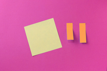 Sticker notes on a bright pink background. Top view, copy space. Business concept, horizontal mock-up