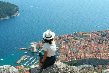 man on a rock in summer inspired by sea view