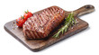 Grilled beef steak on wooden board isolated on white background with tomatoes and rosemary