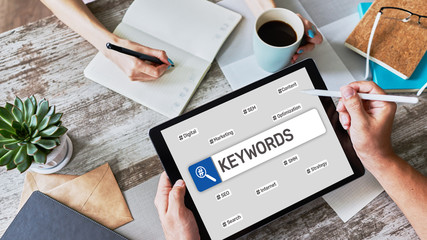 Wall Mural - Keywords. SEO, Search engine optimization and internet marketing concept on screen.