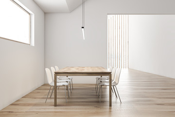 Attic white dining room with long table