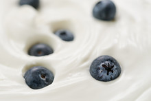 Closeup Of Fresh Blueberries In White Yogurt