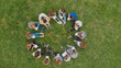 © Довидович Михаил - A group of students are sitting in a circle and books on the grass.