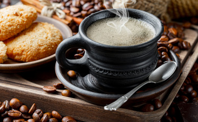 Black coffee on an old background in a cup