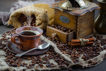 Coffee in a cup and saucer on an old background.