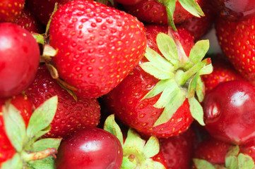 Wall Mural - fresh ripe berries closeup isolated on a white background. Background from fresh ripe strawberries and cherry. Healthy food concept