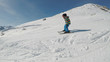 Little boy skiing..A 5 year old child enjoys a winter holiday in the Alpine resort..