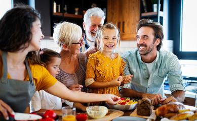 Wall Mural - portrait of happy family in kitchen at home