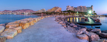 Night Panoramic View From Public Walking Pier On Central Beach And Promenade Of Eilat - Famous Tourist Resort And Recreational City In Israel