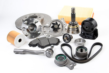 Hub, pump, brake pads, filter, timing belt, rollers, cv joints, thermostat for cars isolated on white background. New car parts .Auto parts background.