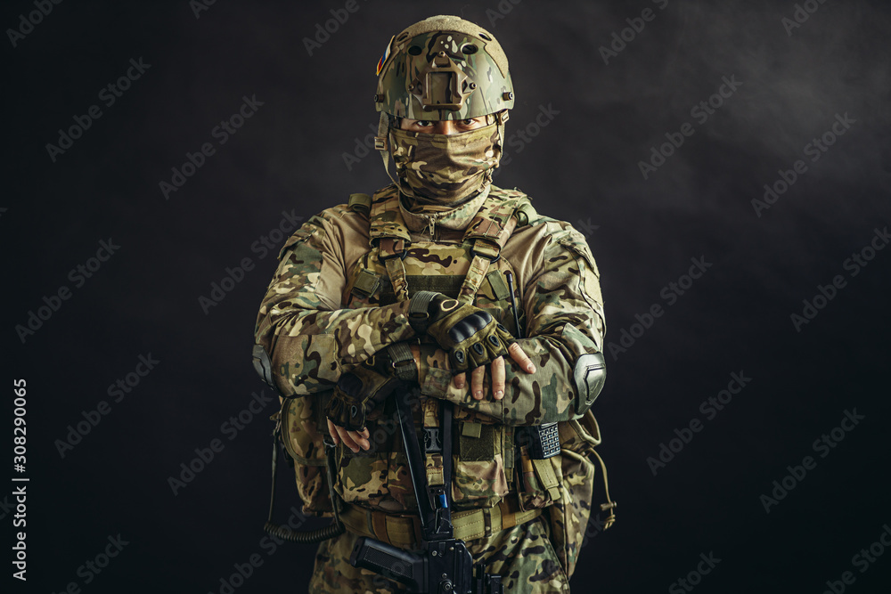portrait of serious confident brave soldier in army wear, camouflage ...