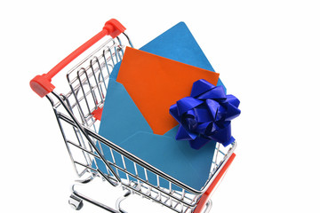 Wall Mural - shopping cart with gifts on white background