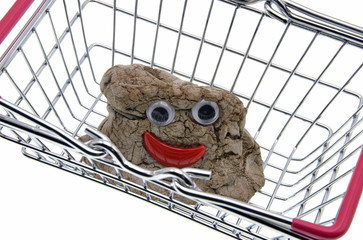 Wall Mural - shopping cart with dough toy isolated on white background