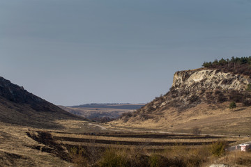 View of a village in the valley. That village located between two hills.