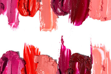 Creative concept photo of cosmetics swatches beauty products lipstick on white background.