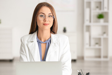 Poster - Beautiful young businesswoman working in modern office