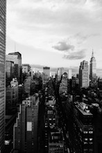 Vertical Grey Scale Shot Of The Buildings And Skyscrapers In New York City, United States