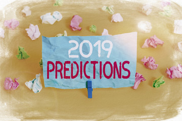 Conceptual hand writing showing 2019 Predictions. Concept meaning statement about what you think will happen in 2019 Colored crumpled paper empty reminder white floor clothespin