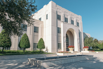 Historic Winter Garden City Hall in Florida. A white three story building made of stone with outside fountain