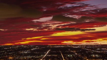Wall Mural - a beautiful sunset over the city of chicago with red, yellow, pink, purple and orange colors explodi