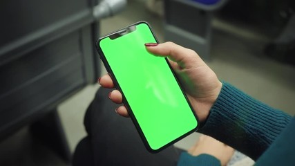 Hands woman hold use green screen phone sitting in bus touch telephone public communication vertical smartphone adult finger chroma urban cellphone application digital scrolling slow motion
